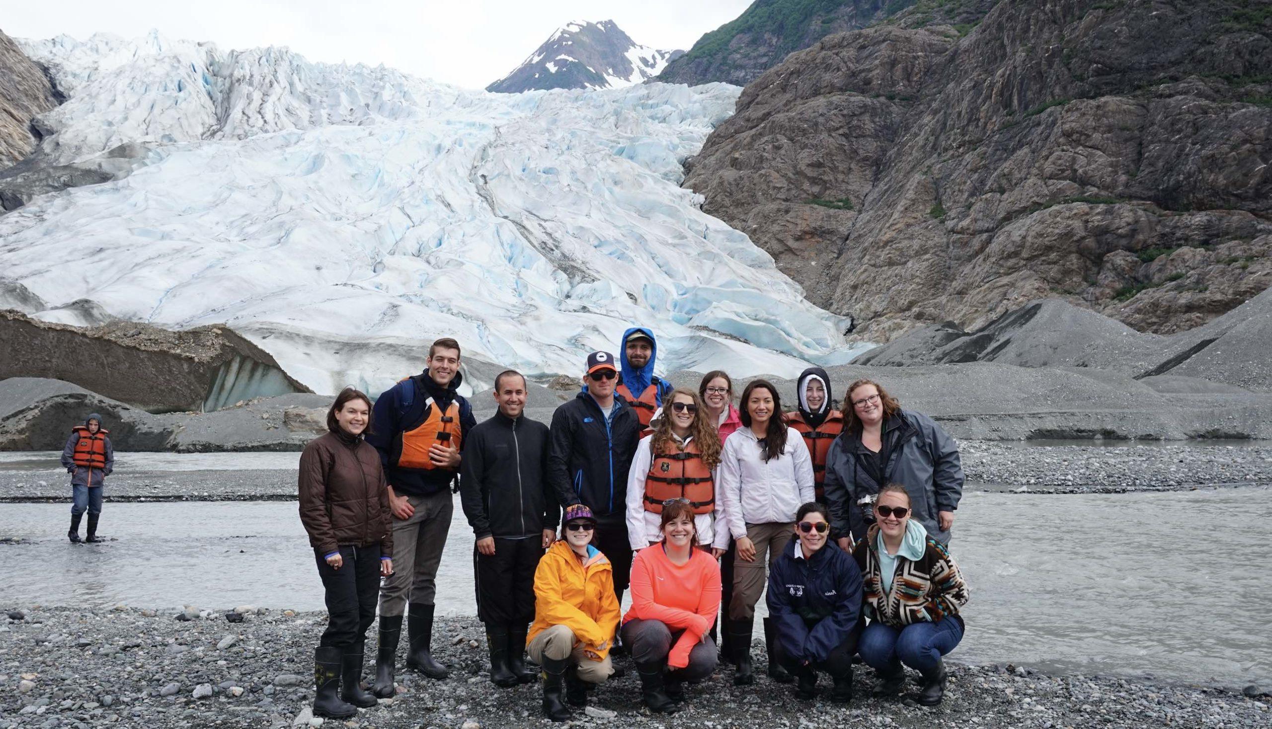 Group photo of students at an Alaskan glacier during the climate change and ecosystems field course